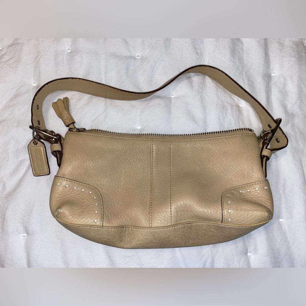 Small Cream/tan coach purse. Used.